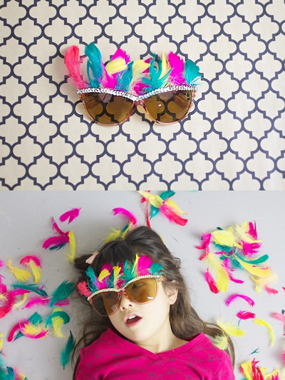 Girl wearing glasses decorated with feathers