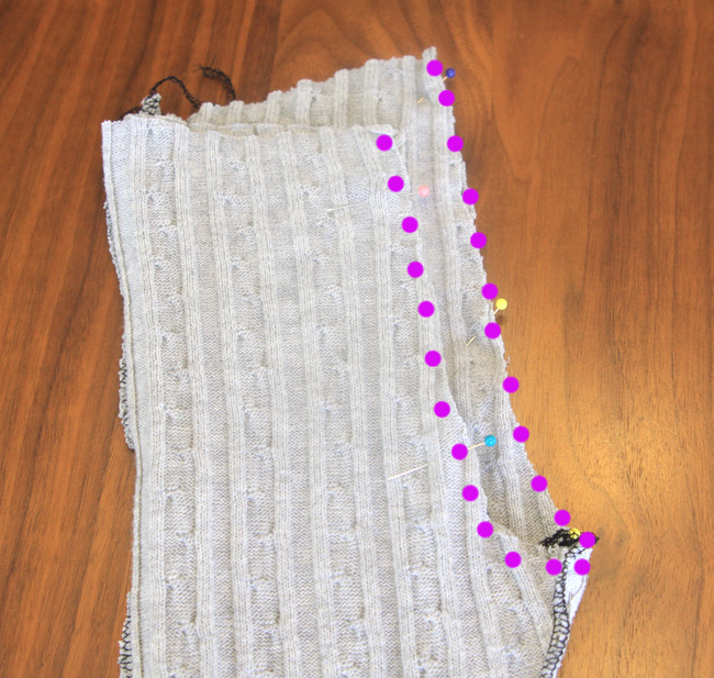 One leggings leg inside the other, with rainbow seam marked