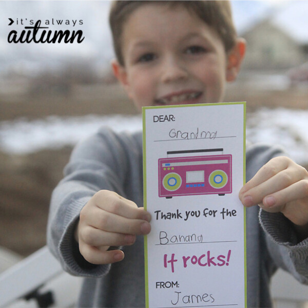 Boy holding a printable fill in the blank thank you card