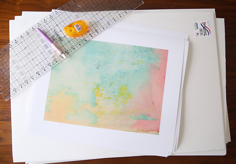 Art prints, white foam core boards, ruler, adhesive, exacto knife