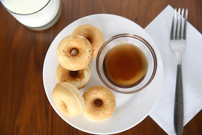 Pancake donuts on a plate with syrup
