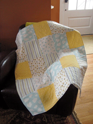 Easy to sew baby blanket made of quilt squares sewn together
