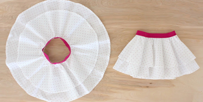 A white circle skirt with pink elastic waistband