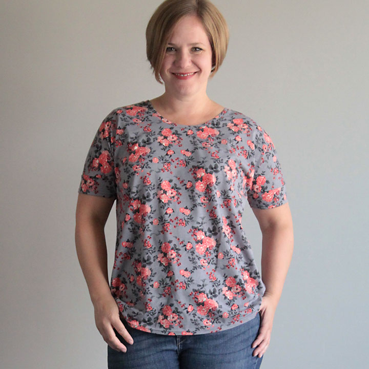 A woman wearing a floral t-shirt