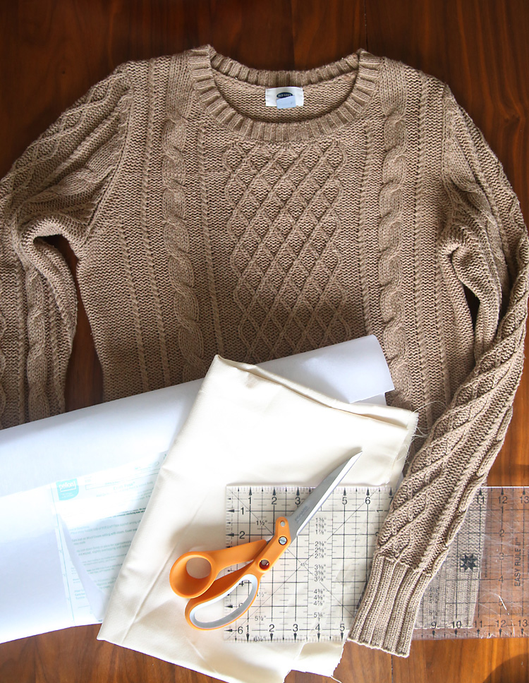 Sweater, interfacing, white fabric, scissors, ruler