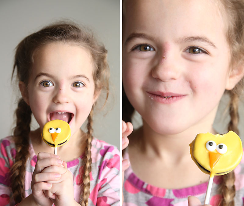 Girl eating an Easter chick Oreo pop