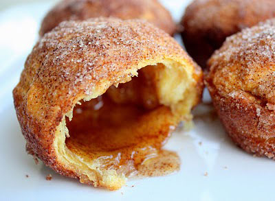 A close up of a hollow roll covered in cinnamon sugar - Easter empty tomb rolls