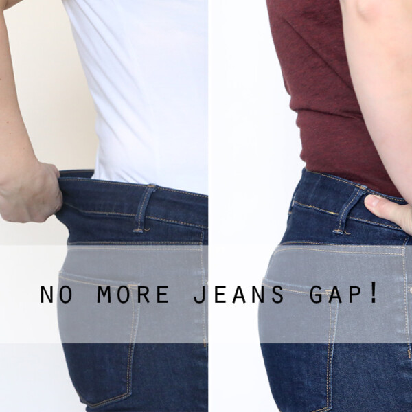 A woman showing a gap in the back waistband of her jeans
