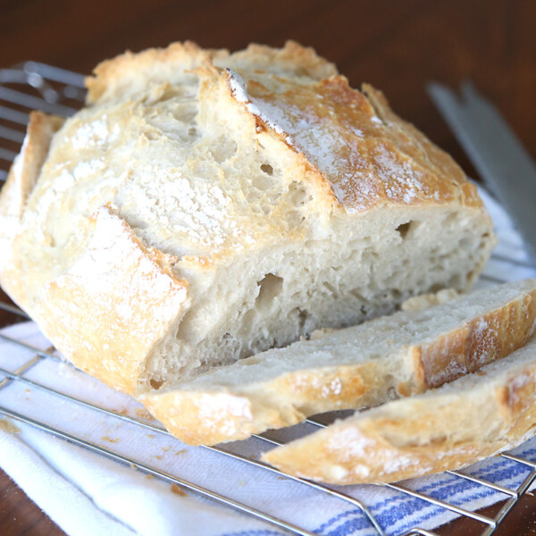 A loaf of easy artisan bread on a cooling rack