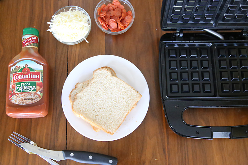 Pizza wafflewich ingredients: bread, pizza sauce, cheese, pepperoni, waffle maker