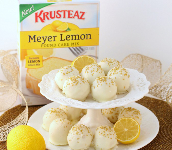 lemon cake truffles covered with with chocolate on a cake stand