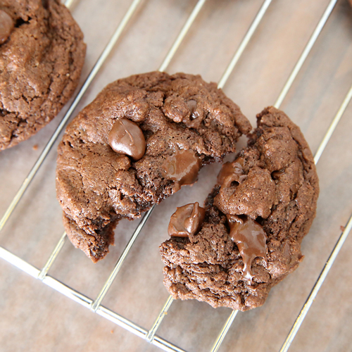 chocolate cake mix cookie broken in half on a cooling rack
