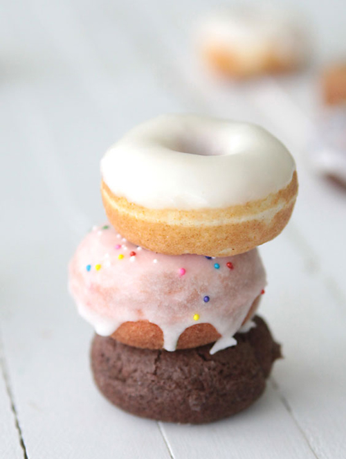 three cake mix donuts stacked up on a table