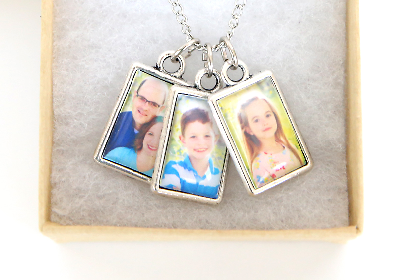 Three photo charms on a necklace