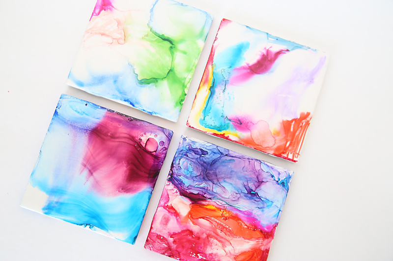 Four multicolored DIY art tiles