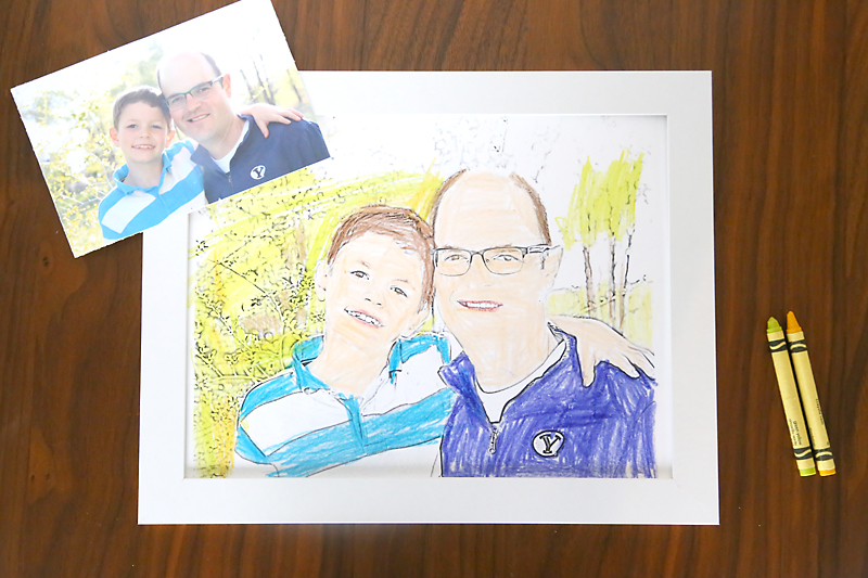 Photo of a boy and Dad and a coloring page made from the photo