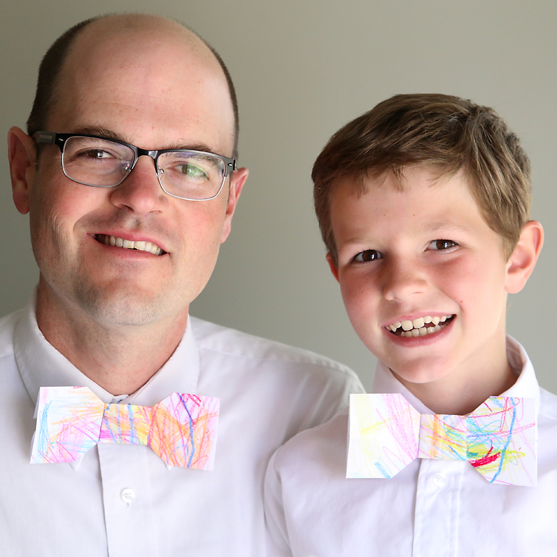 Boy and his father wearing paper origami bowties