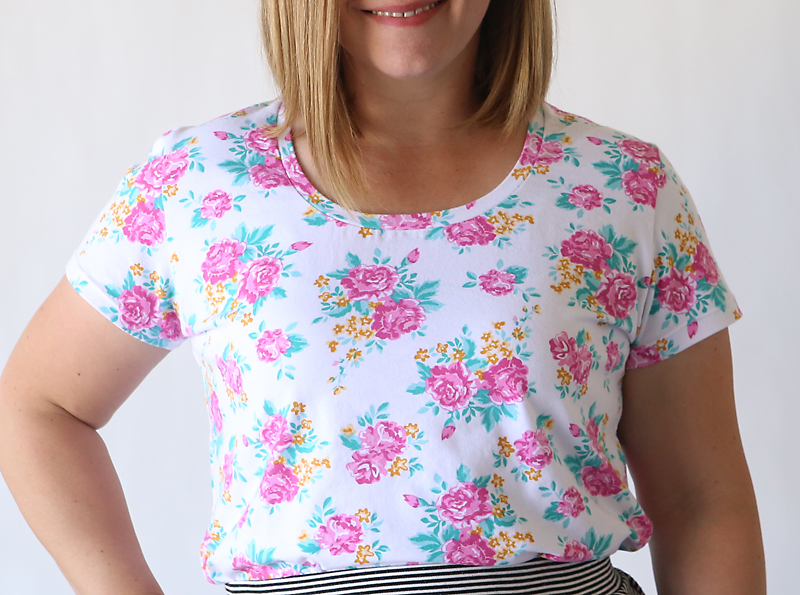 A close up of a girl in a floral shirt