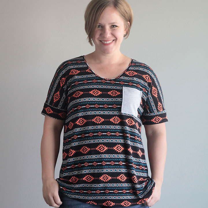 A woman wearing a relaxed fit t-shirt with a pocket on the chest