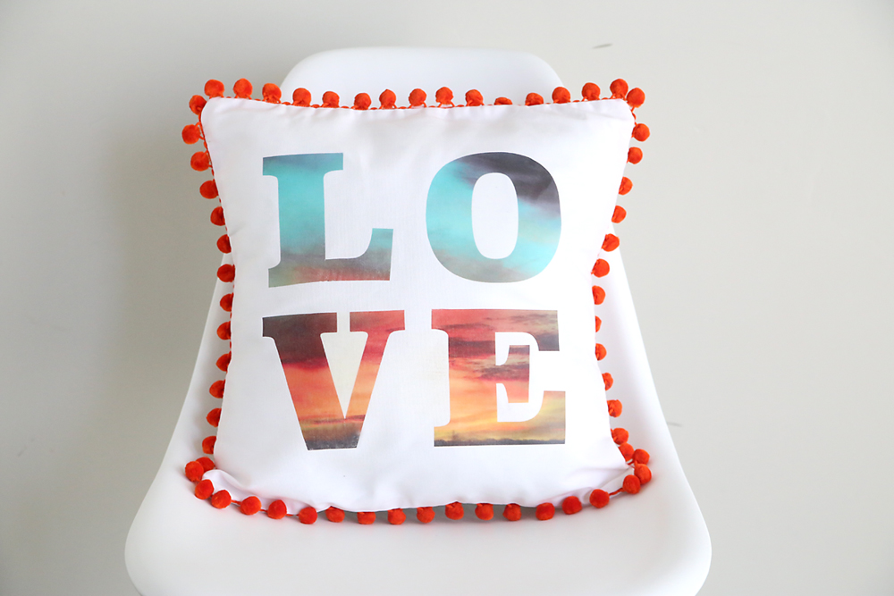 Typographical pillow on a chair