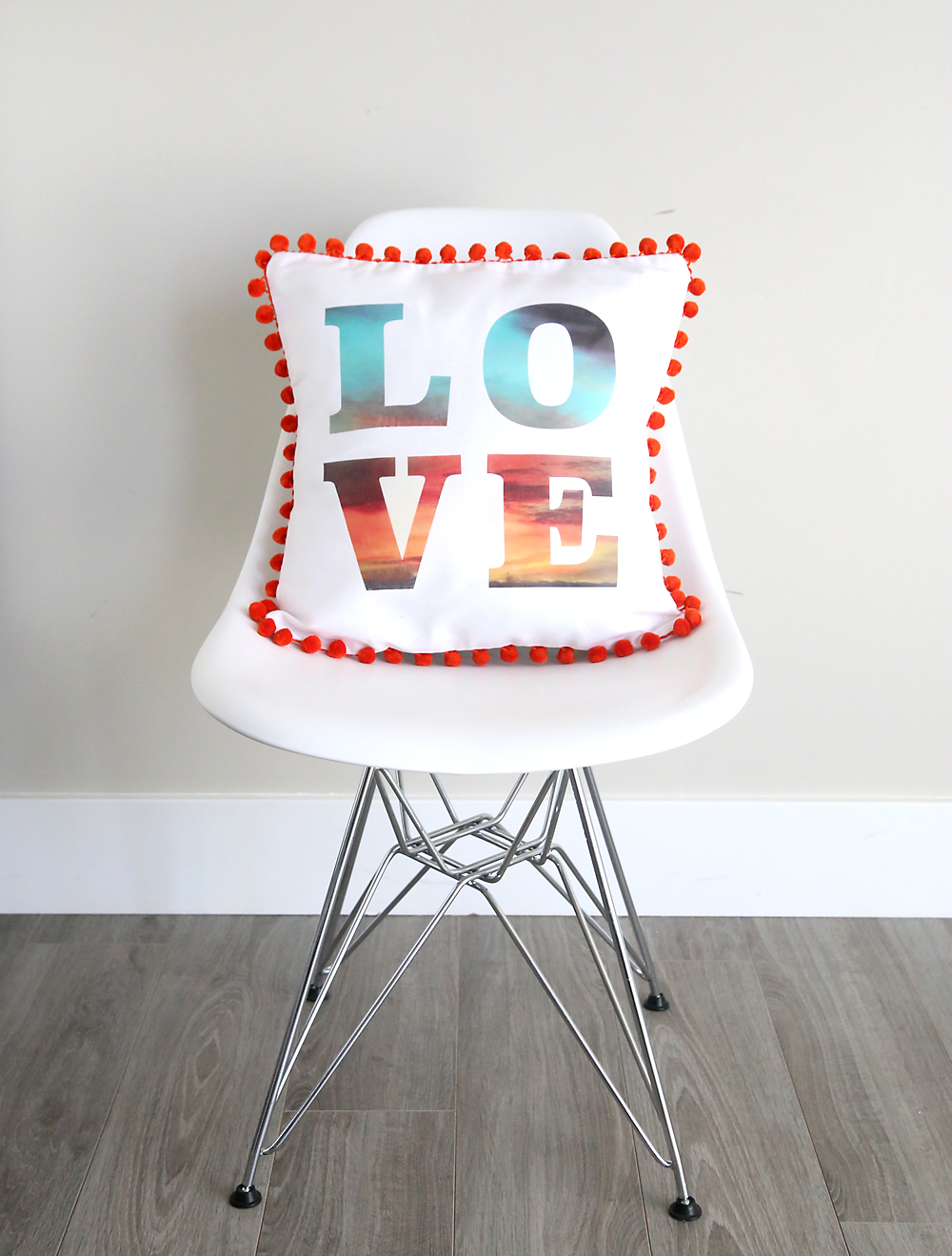 Text throw pillow on a chair