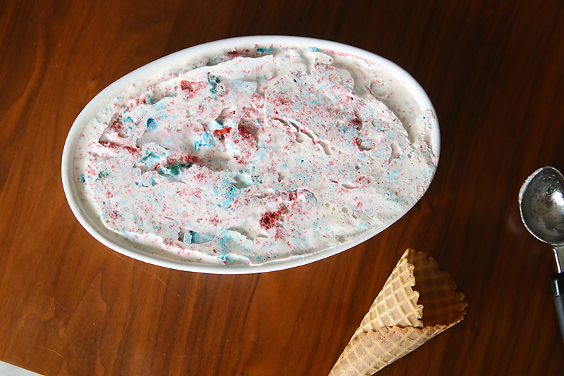 Red white and blue ice cream in a large dish, ice cream cone