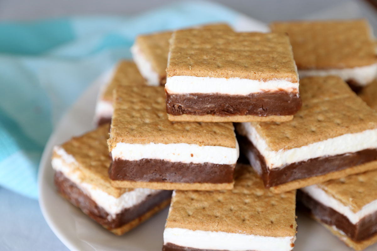 Frozen smores: layers of chocolate pudding and marshmallow creme sandwiched in between graham crackers and frozen!