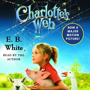 Charlotte\'s Web book cover, with a girl holding a pig