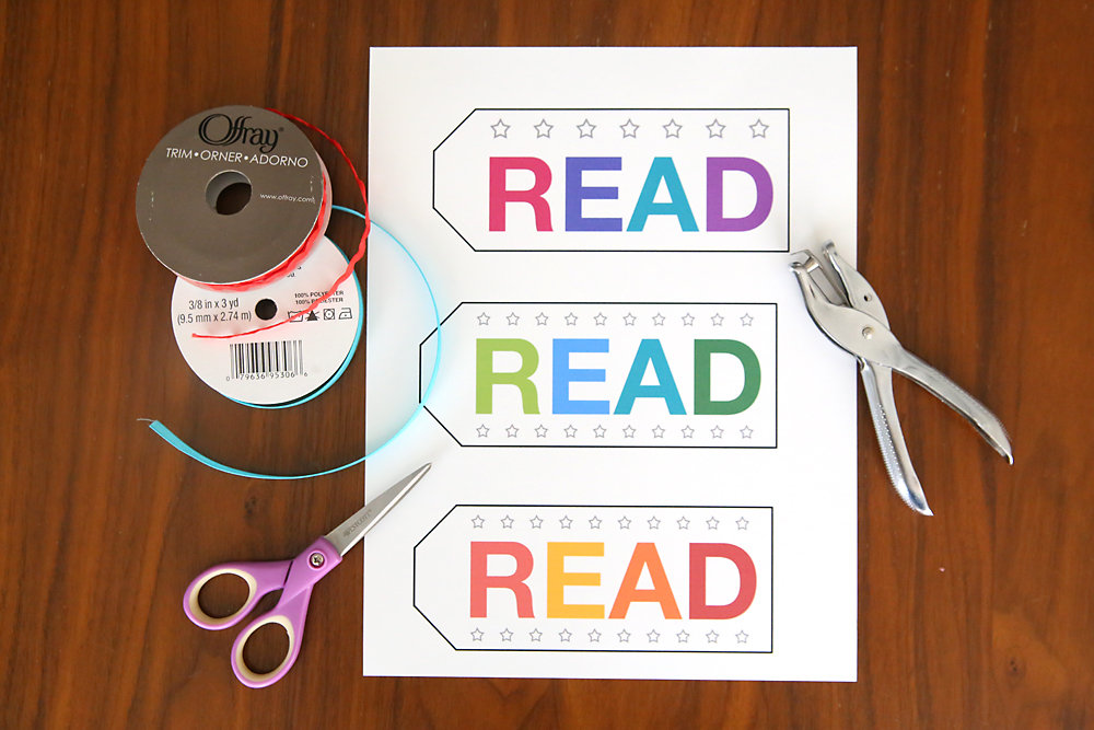 Printable punchcard bookmarks; ribbon, scissors, hold punch