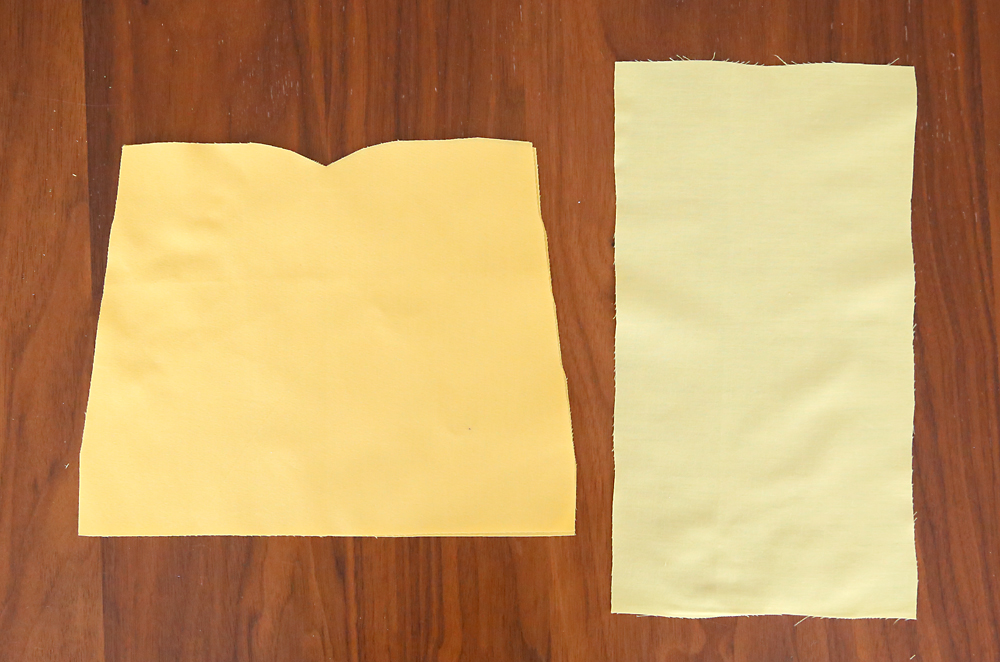 Dark yellow fabric cut into bodice shape, rectangle of light yellow fabric