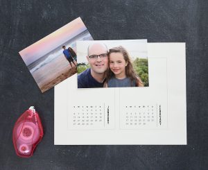 Paper with calendar printed on it; two family photos