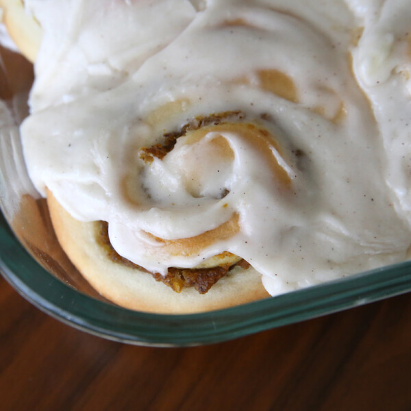 A pumpkin pie cinnamon roll in a baking dish