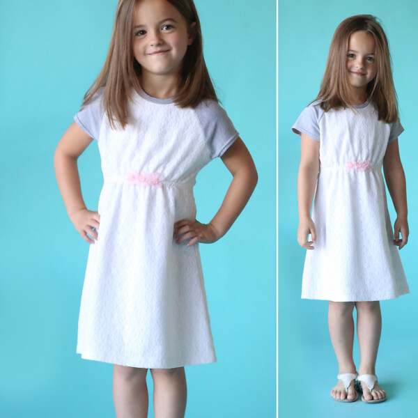 Little girl wearing a raglan sleeve play dress made from a sewing pattern