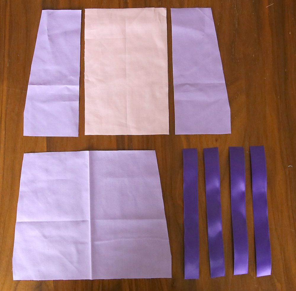 Pink and purple bodice pieces and purple ribbon strips