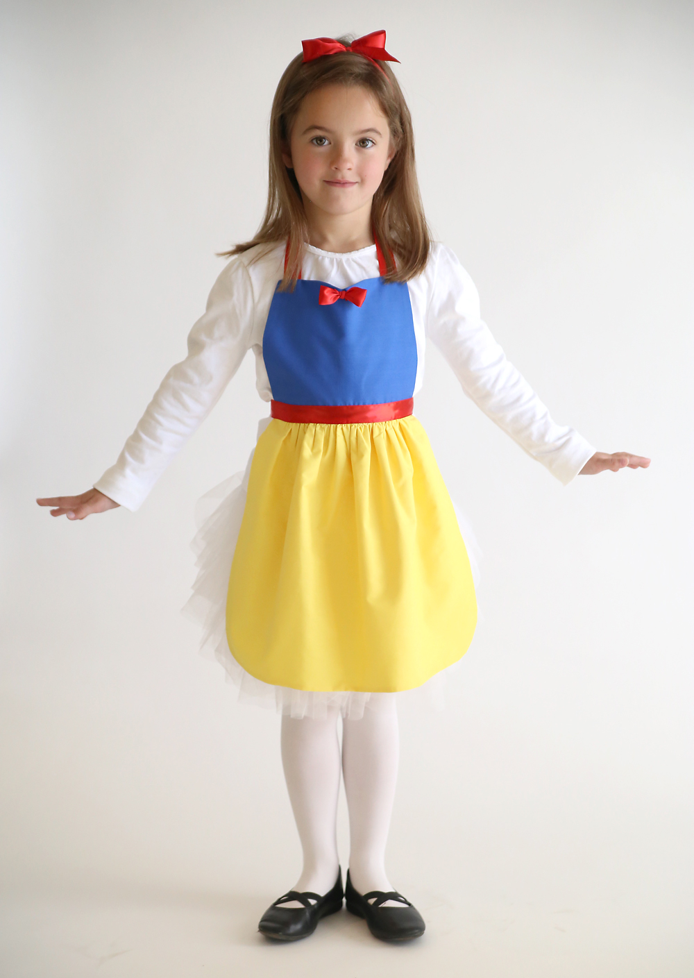 A girl wearing a homemade Snow White princess dress up costume