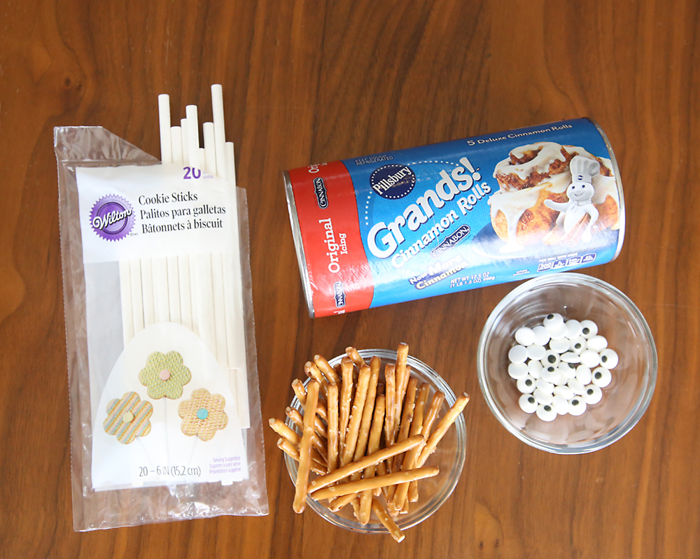 Spider cinnamon roll supplies: candy sticks, pretzel sticks, candy eyes, Grands cinnamon rolls