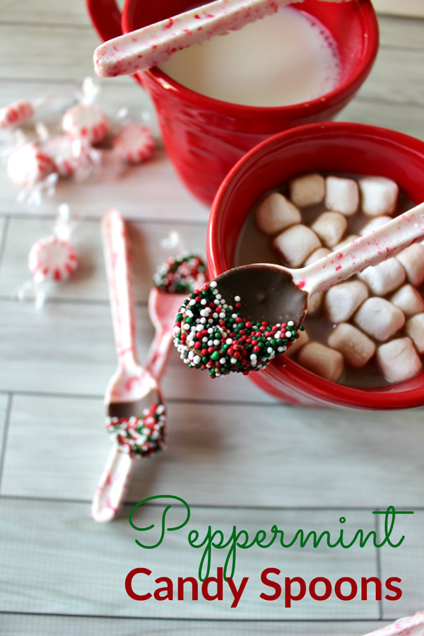 Spoons made from peppermint candy dipped in chocolate and sprinkles, with a cup of hot cocoa