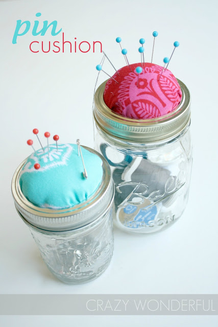 Mason jar sewing kit with sewing essential in the jar and pin cushion on the lid