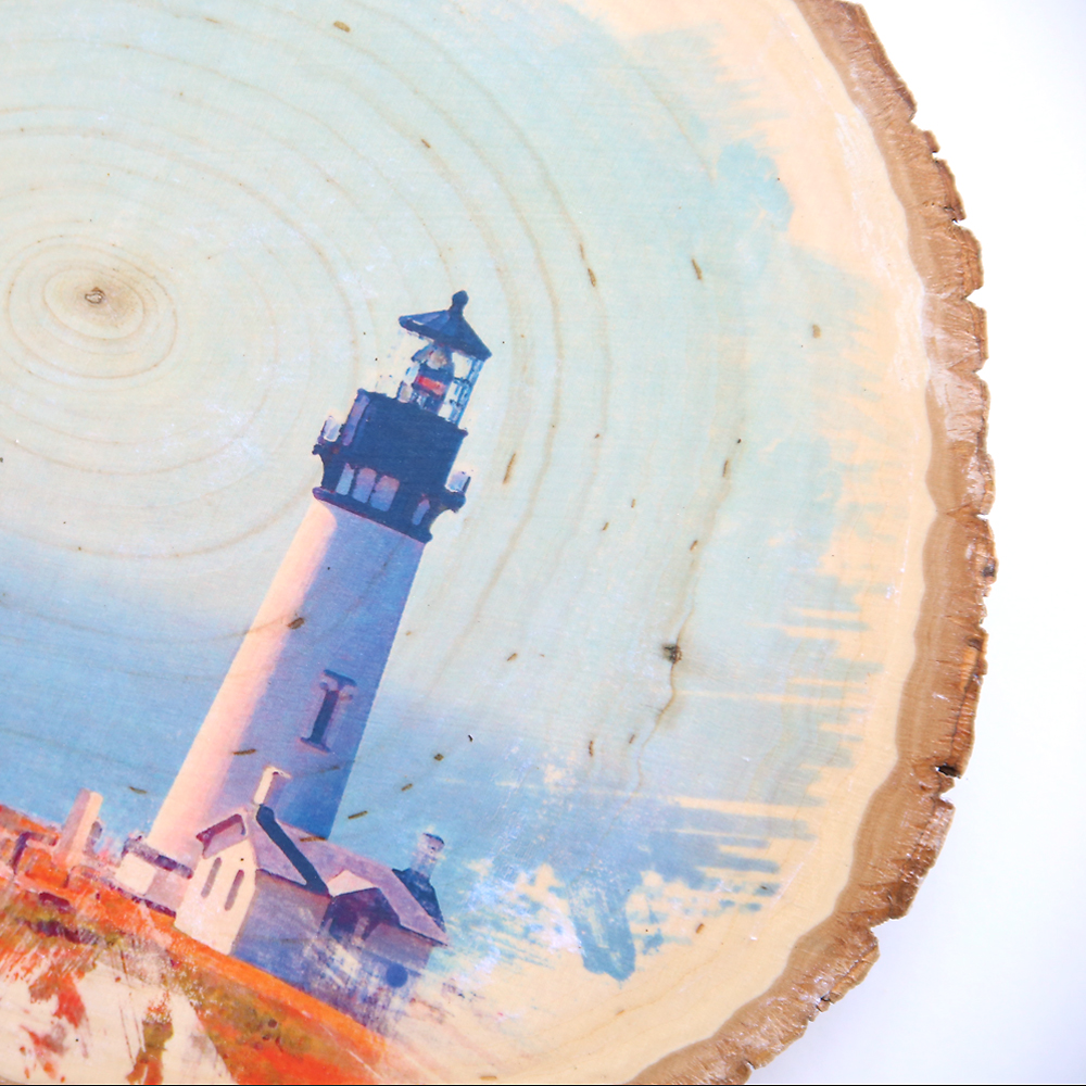Closeup of wood slice with photo transfer on it, wood grain showing through