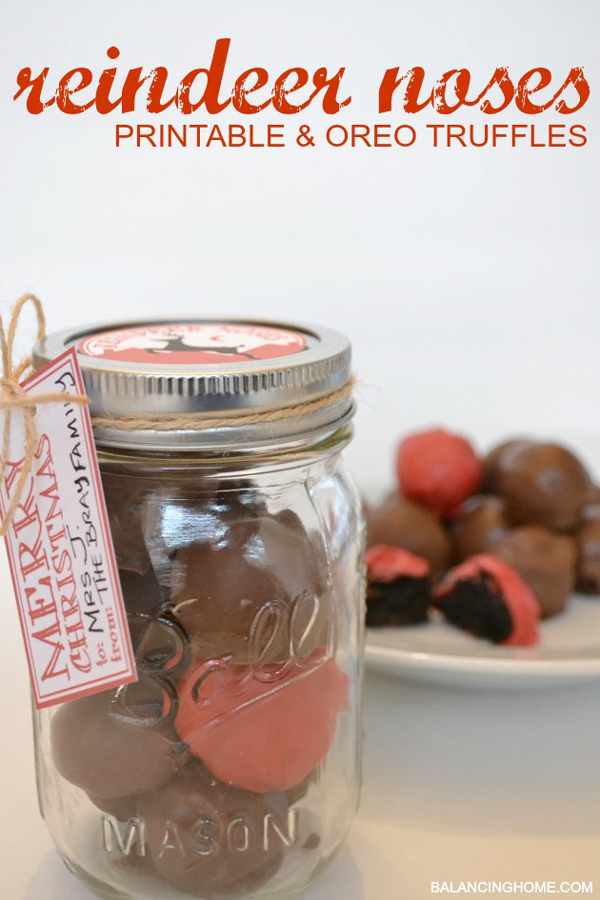 Chocolate truffles in a mason jar with one red truffle
