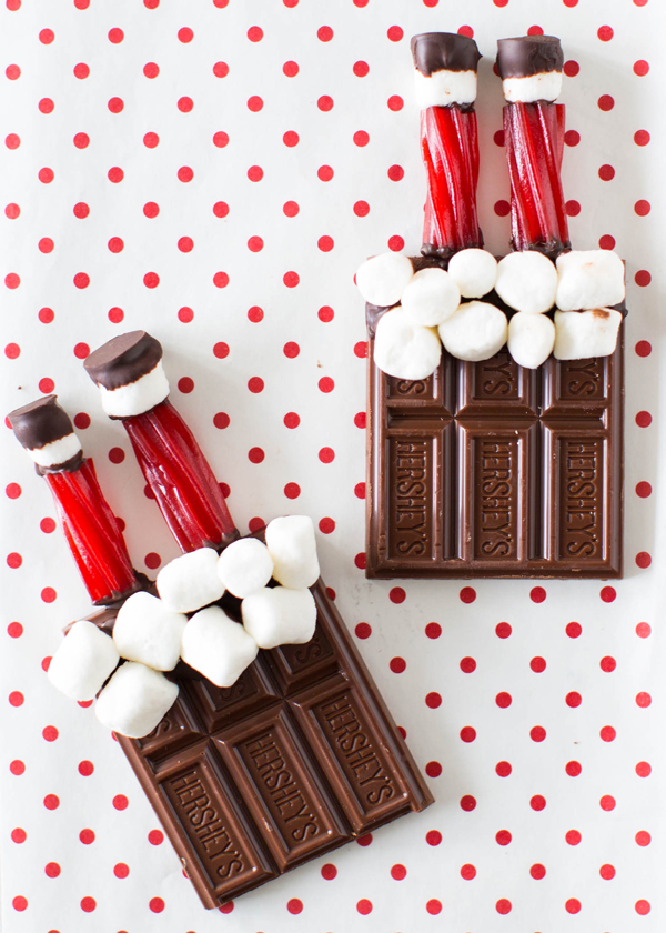 Chocolate bar with marshmallows and Santa legs made from licorice sticks