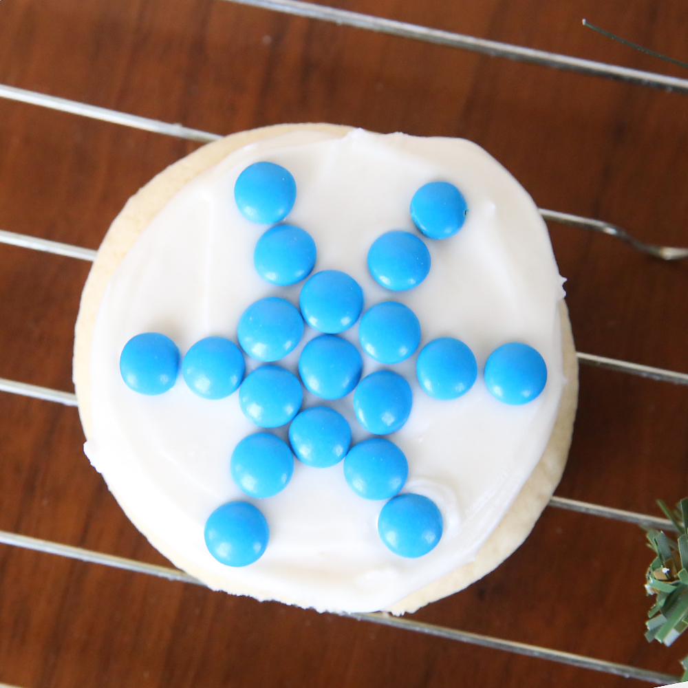 Sugar cookie decorated to look like a snowflake