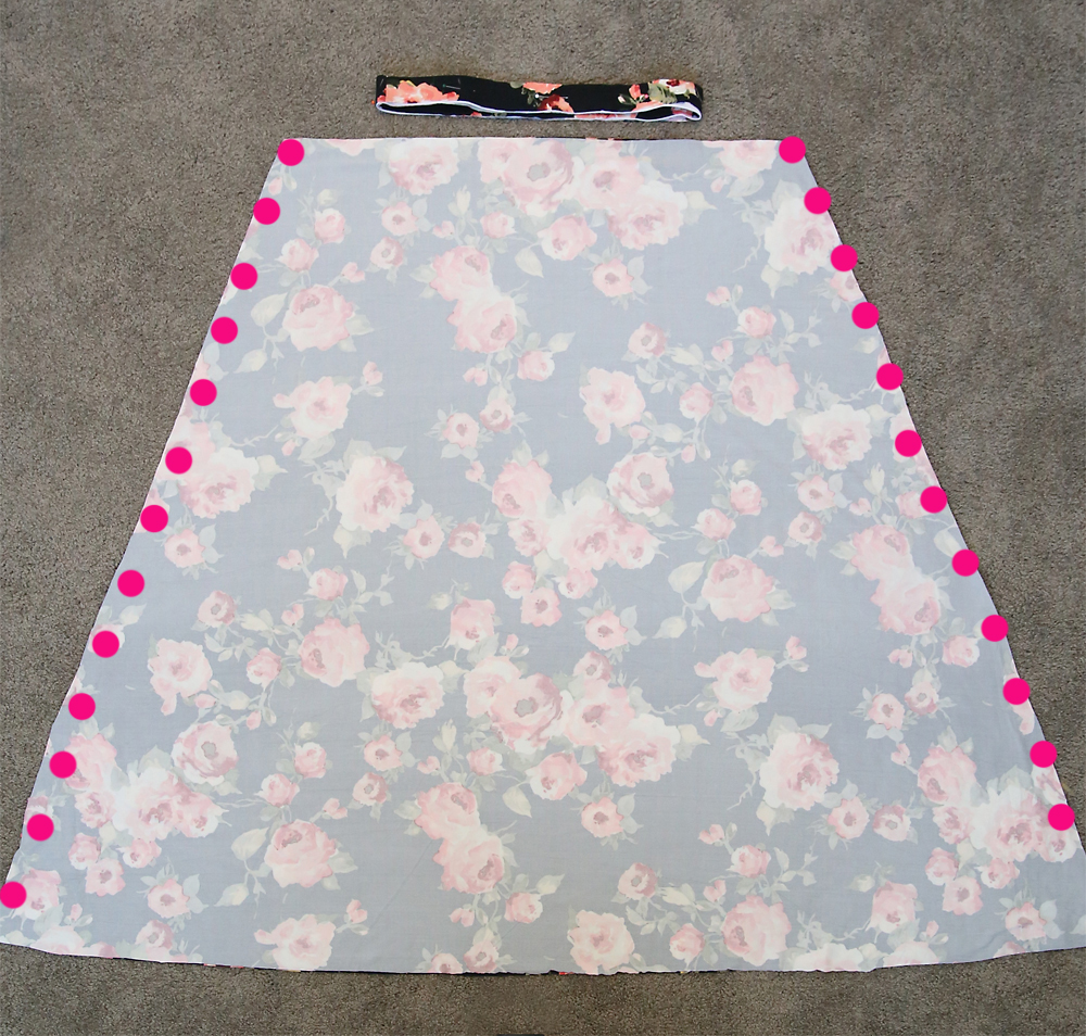 The skirt pieces of the dress laid right sides together, dots down each side to show side seams