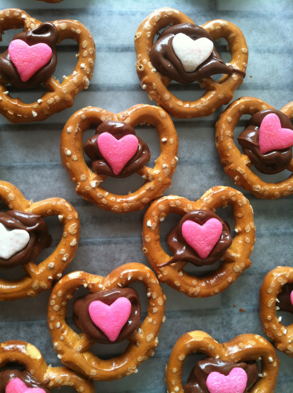 Pretzels treats with chocolate and heart sprinkles for Valentine\'s day