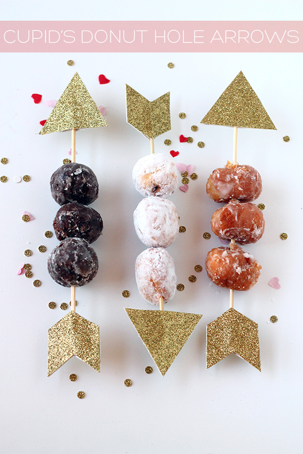 Donut holes with paper arrows through them