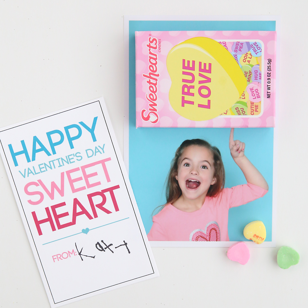 Photo of a little girl pointing up, with box of sweethearts candy glued on and Sweetheart Valentines Day card