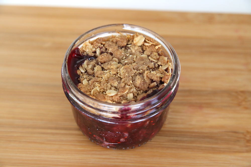 Single serving triple berry crisp in a mason jar