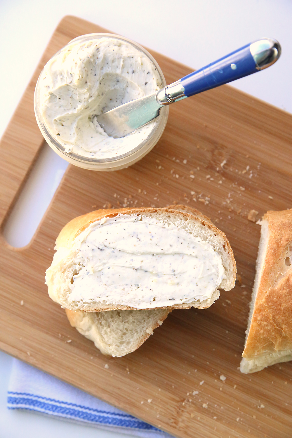 Learn how to make amazing homemade french bread with this easy recipe and video tutorial. It's so delicious! And try the herbed garlic butter too.