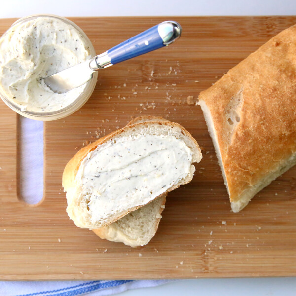 Learn how to make amazing homemade french bread with this easy recipe and video tutorial. It's so delicious! And try the herbed garlic butter too