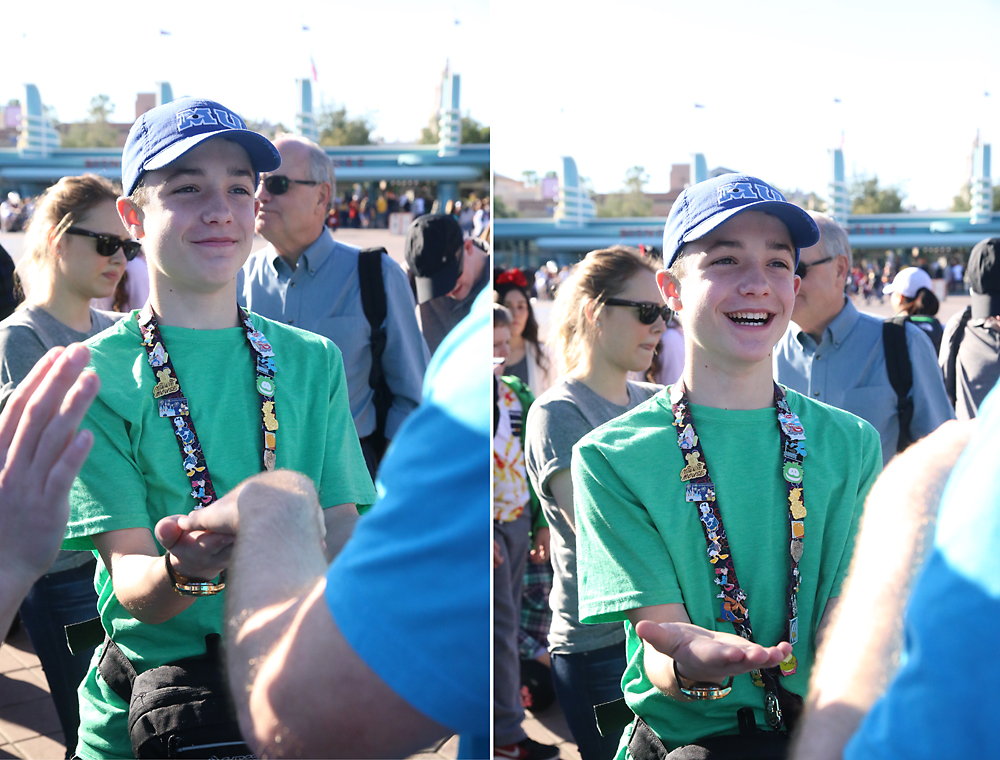 Boy laughing while standing at line to enter Disneyland